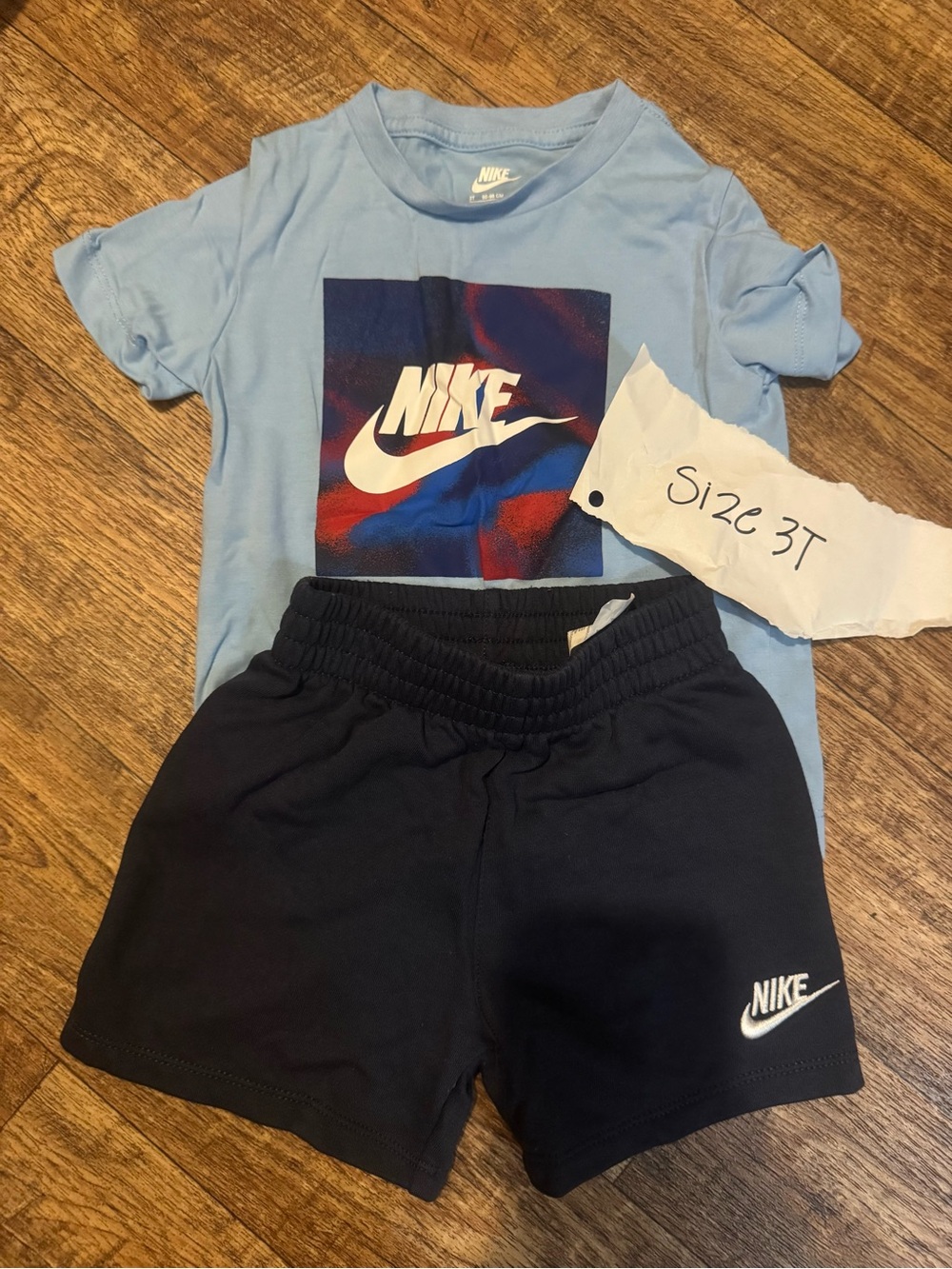 Nike Light Blue Graphic Tee and Black Elastic-Waist Shorts